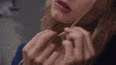 a close up of a woman 's face with red lips