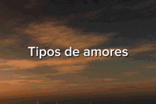 a blurry picture of a woman kissing a baby with the words amor fraternal written below it