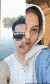 a man wearing sunglasses and a woman wearing a hooded scarf