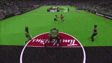 a hockey game is being played on a field that has tim hortons written on it