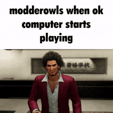 a man in a red suit stands in front of a sign that says modderowls when ok computer starts playing ..