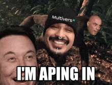a man wearing a beanie that says multivers on it is smiling