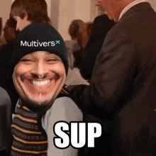 a man wearing a black hat with the word multiverse on it