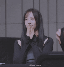 a woman covering her mouth with her hands and the words oldman sunny behind her