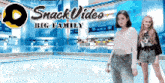 two girls are standing in front of a sign that says snack video