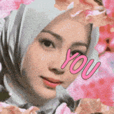 a woman wearing a hijab is surrounded by pink flowers and has the word you on her face