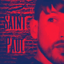 a picture of a man with saint paul written in red