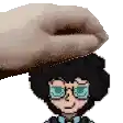 a hand is holding a cartoon character 's head with glasses .