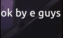 a sign that says ok by e guys with a staircase in the background