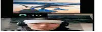 a man wearing headphones has a bandage on his head and a picture of a shark is behind him with the number 0.10