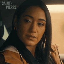 a close up of a woman 's face with the words saint-pierre written above her