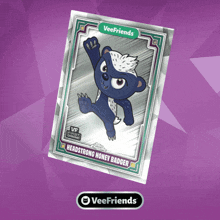 a veefriends card shows a honey badger on a purple background
