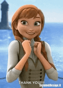 anna from frozen is smiling and holding her hands together in front of the ocean .