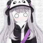 a girl wearing a panda hat with a purple strap