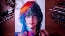 a drawing of a person with colorful hair is on a wooden table with colored pencils