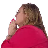 a woman wearing glasses and a watch is praying with her hands folded