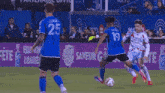 a blurry picture of a soccer game with a player wearing number 23