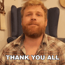 a man in a plaid shirt says " thank you all "