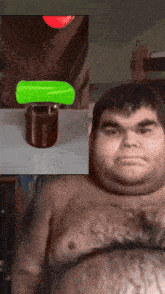 a man without a shirt is next to a green object and a glass of chocolate milk