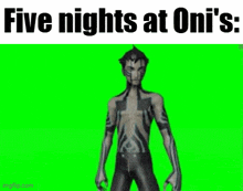 a video game character with tattoos on his body is standing on a green screen .