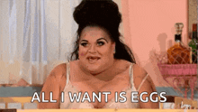 a very fat woman is sitting at a table and says `` all i want is eggs '' .