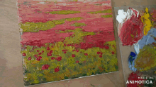 a painting of a field of flowers is being made by animatica