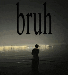 a man standing on a beach with the word bruh written above him