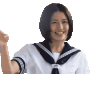a woman in a sailor uniform is smiling and giving the thumbs up