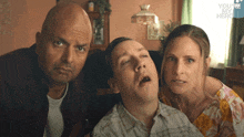 a man with his mouth open is surrounded by two other people and the words you 're my hero are on the bottom right