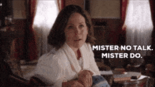 a woman sitting in a chair with the words mister no talk mister do behind her