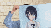 a woman holds up a picture of a girl with short hair
