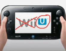 a person is holding a wii u game controller with a red circle around the wii u logo