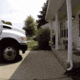 a truck is parked in front of a house