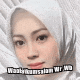 a woman wearing a white hijab has the words waalaikumsalam wr.wb written on her face