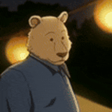 a cartoon bear wearing a blue shirt and tie is standing in front of a street light .