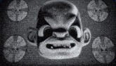 a black and white image of a cartoon character 's face with skulls around it