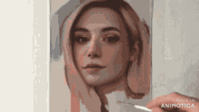 a person is painting a woman 's face with a brush on a canvas .