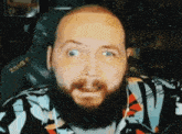 a man with a beard is wearing a shirt that says zone