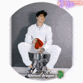 a picture of a man sitting on a stool with the name ahmed dragon on it