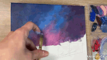 a person is painting a picture with a brush and the words made in animatica are visible