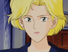 a woman with blonde hair and green eyes looks at the camera