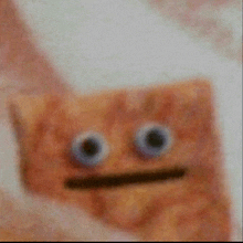 a close up of a cracker with a face on it