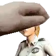 a woman in a police uniform is being slapped by a large hand .