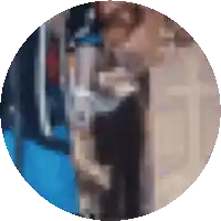 a blurry picture of a person in a blue shirt