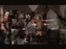 a blurry picture of a group of people sitting at a table