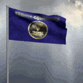a blue flag with tropez community written on it