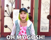 a girl with green hair is standing in front of a door that says " oh my gosh "