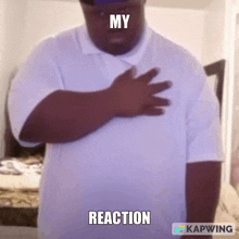 a man in a white shirt holds his hand to his chest with the words my reaction written above him