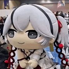a stuffed doll of a girl with white hair