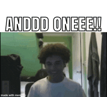 a man with curly hair is standing in a room with the words andddd oneeee !